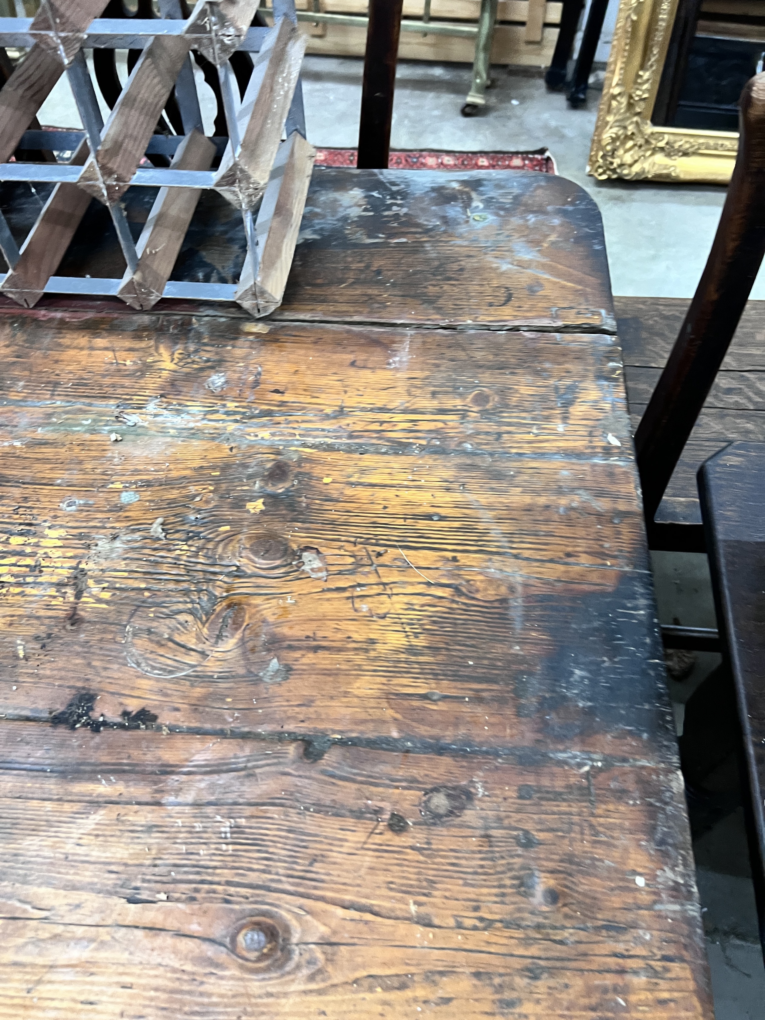 A 19th century rectangular pine planked top kitchen table, length 206cm, width 102cm, height 71cm